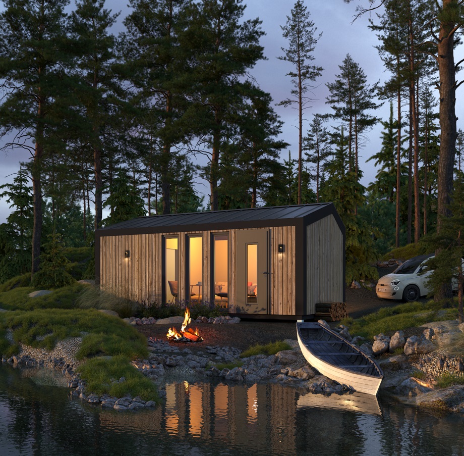 Timber-clad modular cabin with warm interior lighting on a lakeside at dusk