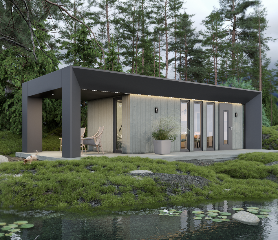 Modern modular home with dark cladding and large windows set by a lakeside surrounded by pine trees